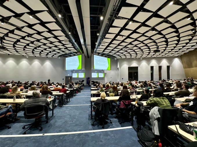 Audience in a large lecture theatre as Patricia Hill Collins delivers her lecture 