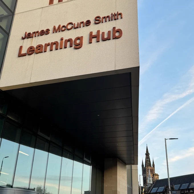 Exterior of the James McCune Smith Learning Hub with the University Tower in the background 