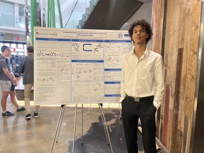 Liam Ryals with his research posterboard