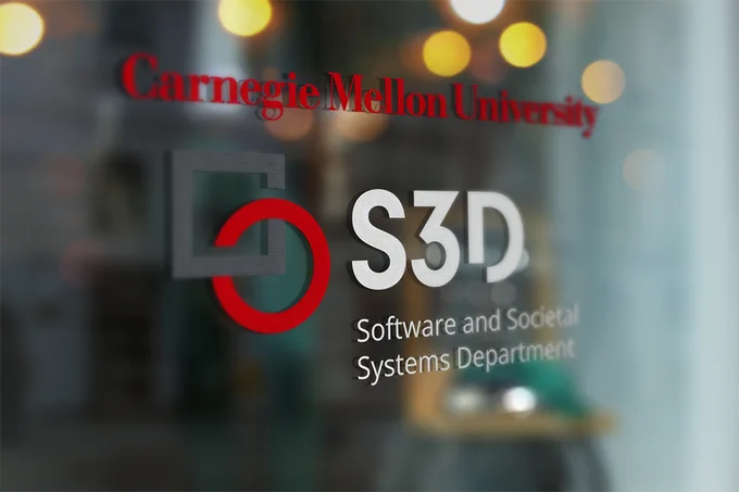 Logo of Carnegie Mellon University's Software and Societal Systems Department (S3D) on a glass door, with the name "Carnegie Mellon University" prominently displayed above the department name and logo.