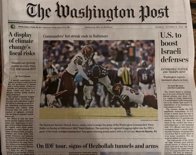 The Washington Post front page above the fold on Monday, Oct 14. Photo of football players. Headlines about "climate change," On IDF tour...", and "Israeli defenses."
