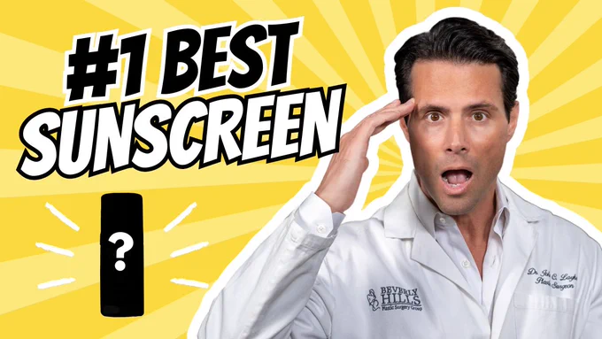 Dr. John Layke, plastic surgeon to the stars, is shocked as, Dr. Vicki Rapaport, a renowned dermatologist reveals the #1 best anti-aging suncreen. Dr. Layke, has short hair and is wearing a white lab coat over a professional dress shirt. The image features the title “The #1 Best Sunscreen” in bold, eye-catching text. The background showcases a clean, inviting environment that is like the sun. It is explosive. There is an image of a bottle of suncreen with a question mark hovering over it. #Pavise #Sunscreen #antiaging #acnemangement #dermatology #plasticsurgeons #cosmeticsurgeons #skincare #celebrity secrets #celebritydermatologist #celebritysurgeons