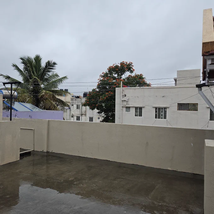 An overcast sky and a damp terrace.