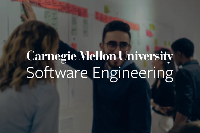 Individuals collaborating in front of a board covered in notes at a Carnegie Mellon University Software Engineering workshop.