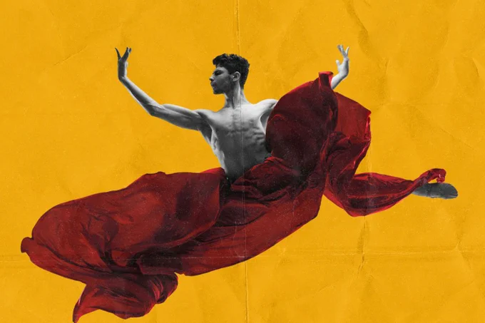 A photo showing a man leaping through the air with no shirt on, surrounded by a red shawl 