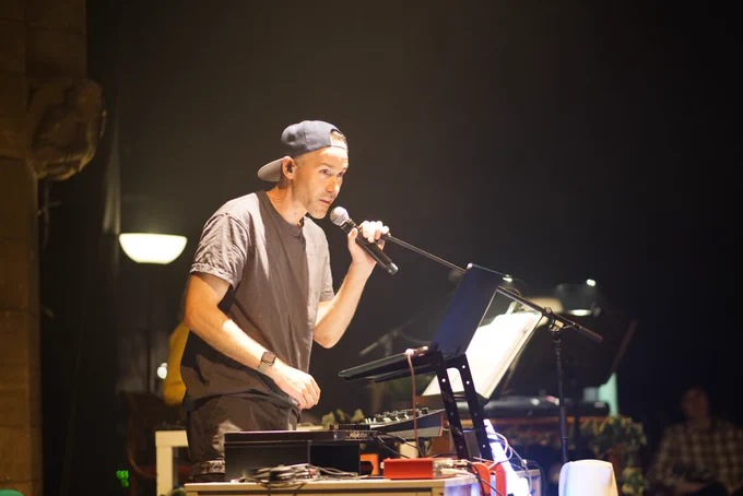 Production image of musician Solareye performing in A Giant on the Bridge.