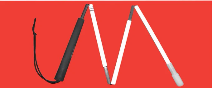Image of a folded white cane on a red background