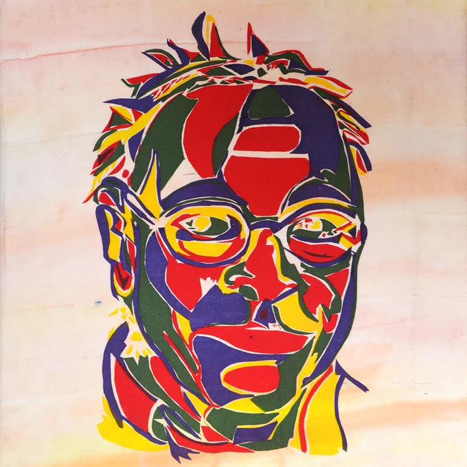 Portrait of a woman using fabric on a textile background. The fabrics used are bright, block colours. 