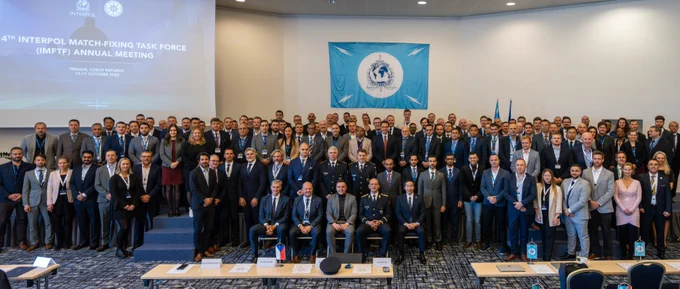 Group picture under the INTERPOL flag of the participants of the 14th annual Match Fixing Task Force Meeting held in Prague, Czech Republic.