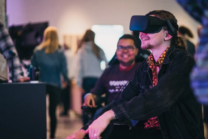 A person trying a virtual reality exhibit 