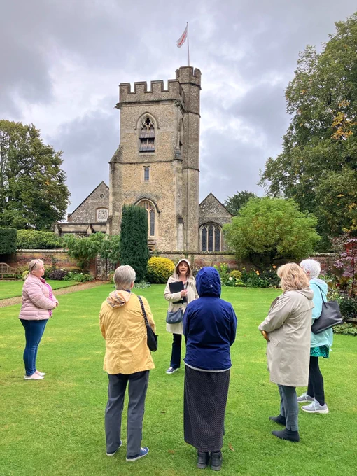 A group of people outside a church.