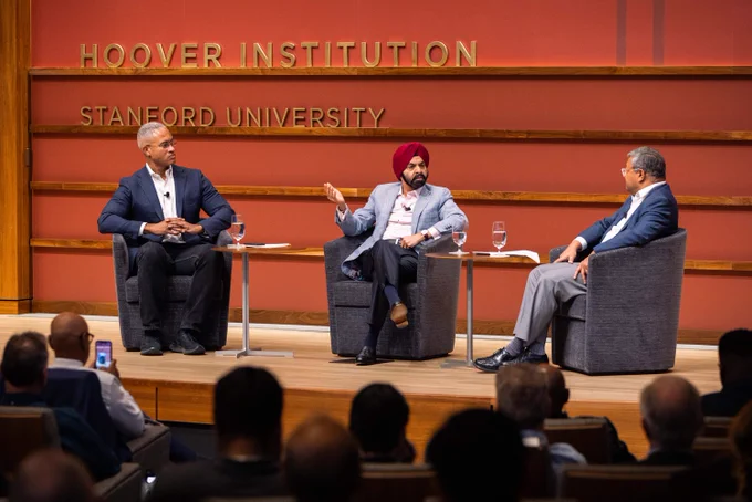 Ajay Banga speaks on stage with Peter Blair Henry and Arun Majumdar