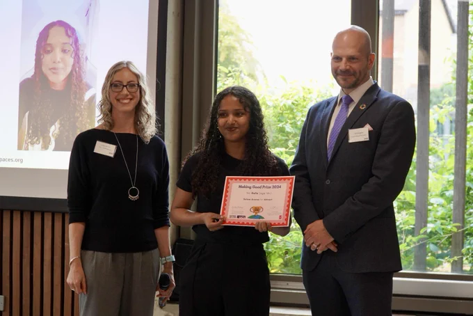 Photograph of prize winner, Selem Arasa receiving her award from Professor Louise Archer and Dr Tim Slingsby.