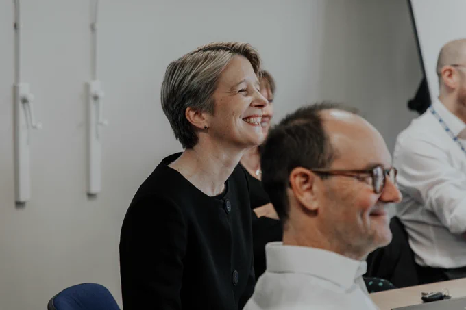 NHS England CEO smiling sat down 
