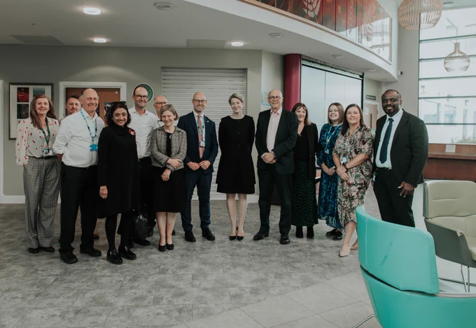 LSCft, ICB and NHS England colleagues smiling in the harbour reception 