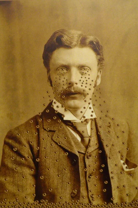 Archival sepia toned portrait of a man, with many smaller eyes streaming from his eyes