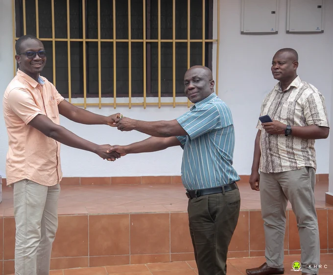 Contractor officially handing over the keys to the building