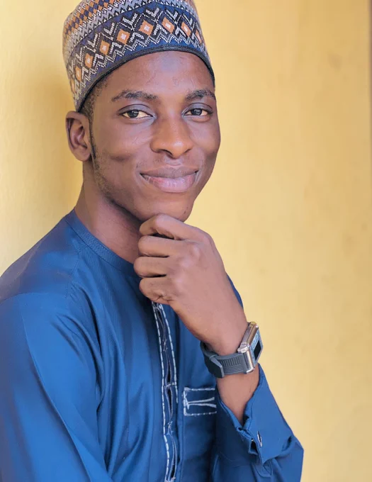 A black man smiling because it is Friday