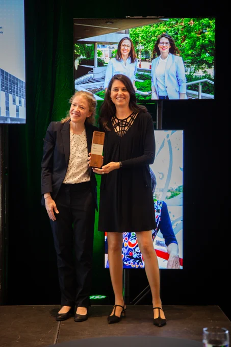 Eva Hemmer receives an Early Career Researcher Award from Julie St-Pierre.