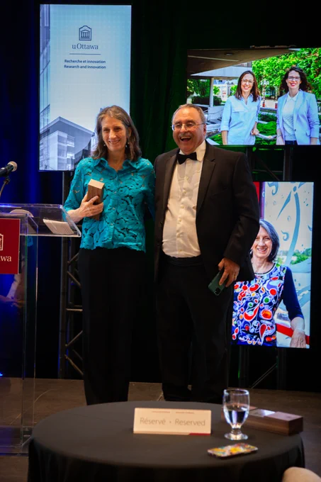 Sylvain Charbonneau presents the EDI in Research award to Catherine Mavriplis.