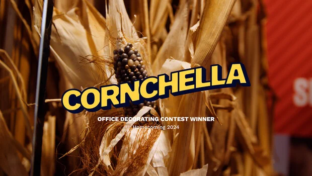 Cornstalk with text, "Corncehella Office Decorating Contest Winner Homecoming 2024" 