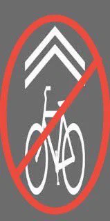 sharrow stencil with a “no” symbol overlaid