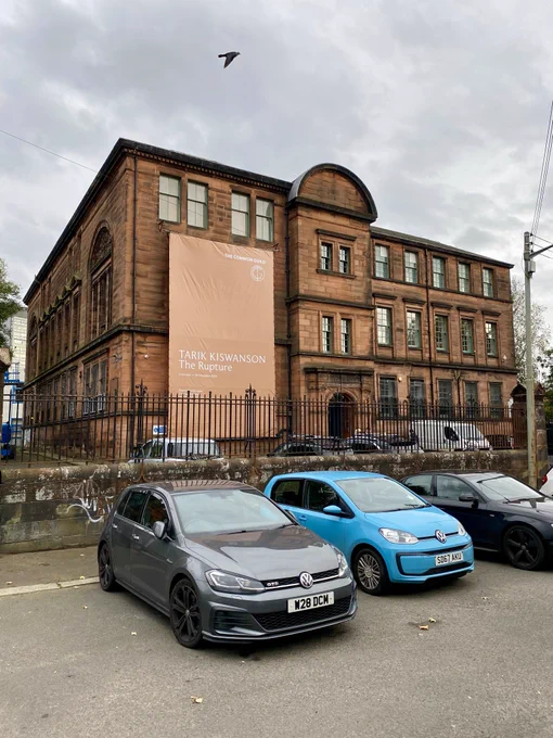 This is big red sandstone building is architect Thomas Lennox Watson’s former Adelphi Street School, a Glasgow School Board building which is being repurposed as flexible ‘found’ office space. It’s is also being used for exhibition of contemporary art including the Common Guild’s new exhibition ‘The Rupture' by Tarik Kiswanson hence the large fabric banner draped down the building.
