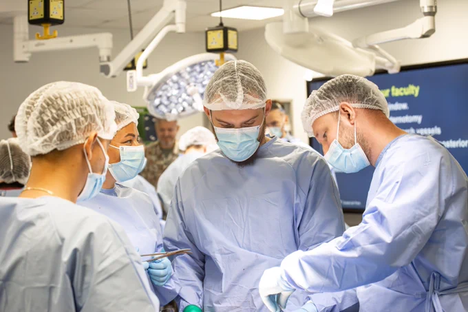 A surgical team from Ukraine work together  in a surgical training simulation during a UK Defence Medical Services training course. 