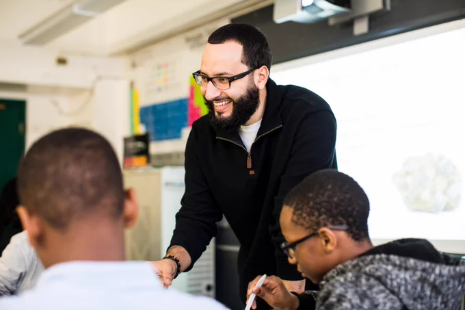 NYC Public Schools teacher with students in class.