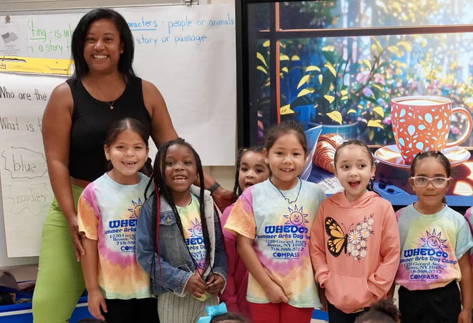 NYC Public Schools teacher with students in class.