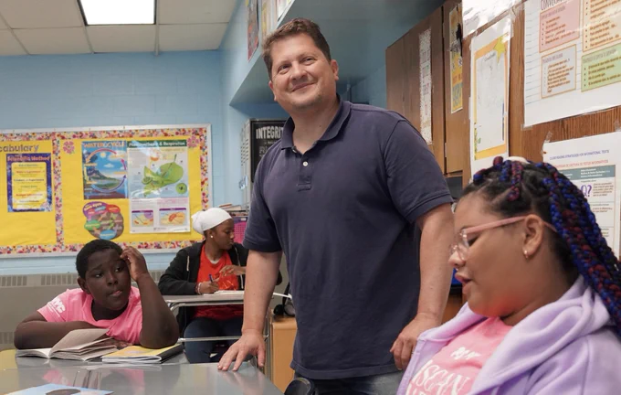 NYC Public Schools teacher with students in class.