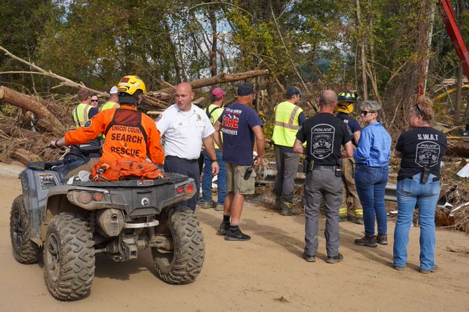 Members of the New Jersey Task Force 1 Urban Search and Rescue conduct operations across Buncombe County in Asheville, NC.