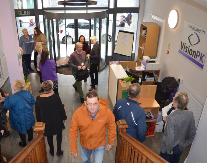 Guest arriving at the sensory hub, chatting in the reception area