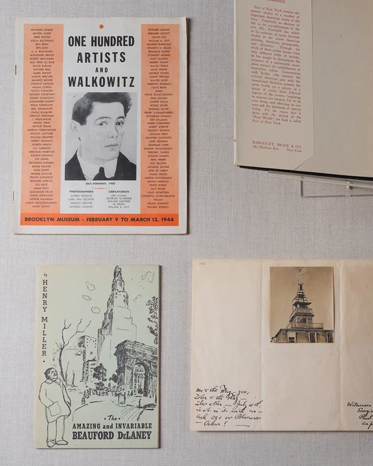 Photograph from above of publications on artists such as Beauford Delaney and Abraham Walkowitz.