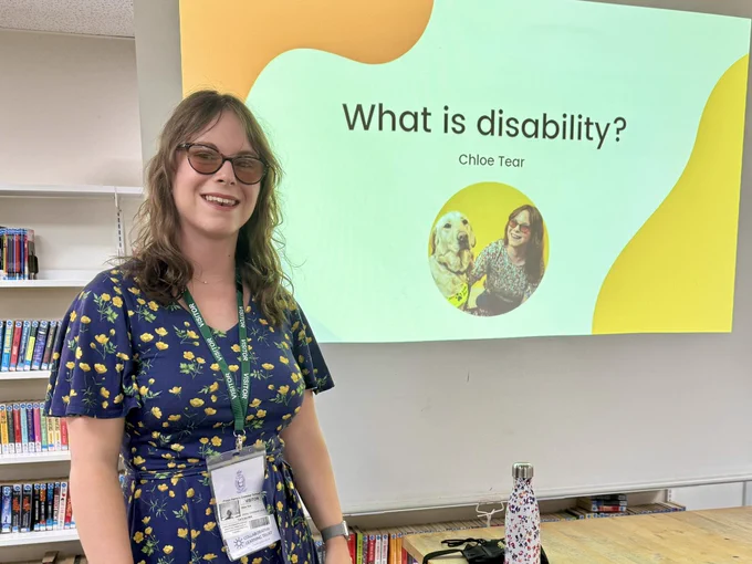 Adult Chloe giving a presentation