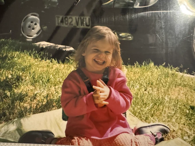 Young Chloe sat on the floor