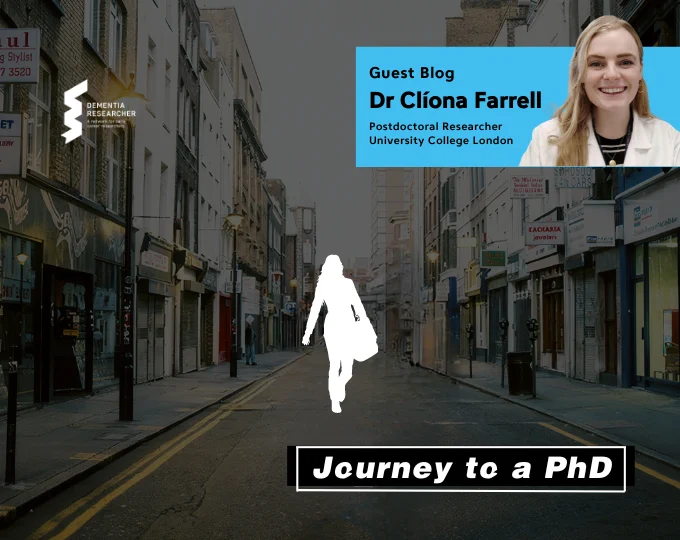 
The image shows a narrow city street lined with buildings and shops under a cloudy sky. In the foreground is a silhouette of a person walking, positioned above the words "Journey to a PhD" in bold. At the top right corner, there is a blue banner that features a photo of Dr Clíona Farrell, along with the text: "Guest Blog, Dr Clíona Farrell, Postdoctoral Researcher, University College London." The Dementia Researcher logo is visible on the left side of the image.