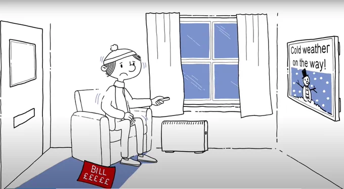 A person dressed in warm clothing, including a hat and scarf, sits in an armchair holding a remote control, looking concerned while watching a heater. A bill with pound signs (£££) lies on the floor, suggesting high energy costs. On the TV screen, there is an image of a snowman with the text 'Cold weather on the way!' signalling colder temperatures and potential heating challenges.
