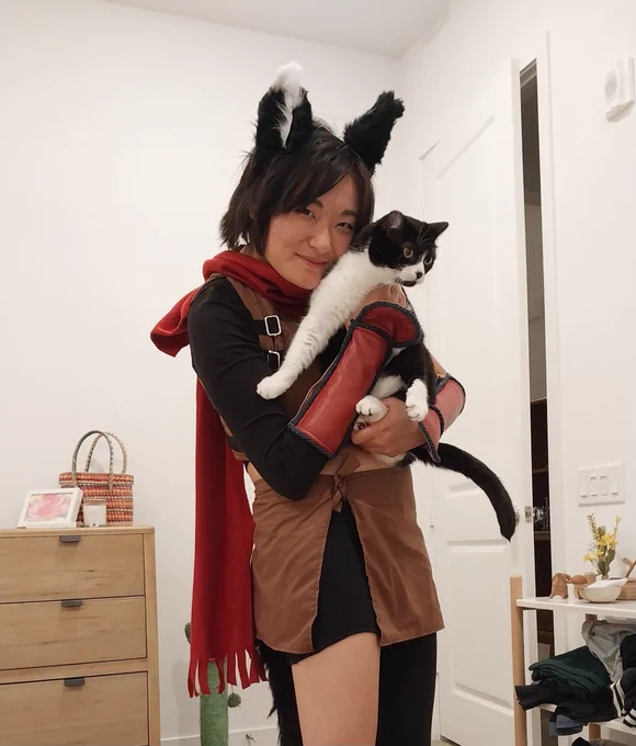 Me as izutsumi holding moomy, my tuxedo cat