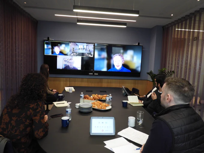 Another photo of us taken around the table. You can see Alona from Shaw Trust speaking on the big screen, and the others in smaller boxes.