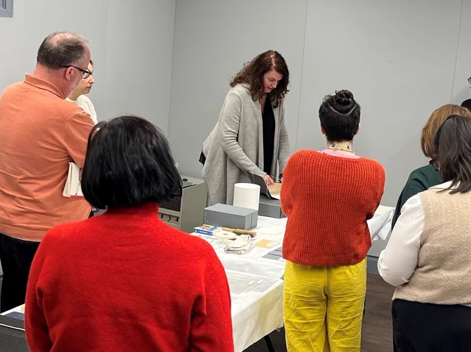 Participants watch an instructor demonstrating the use of phase boxes.