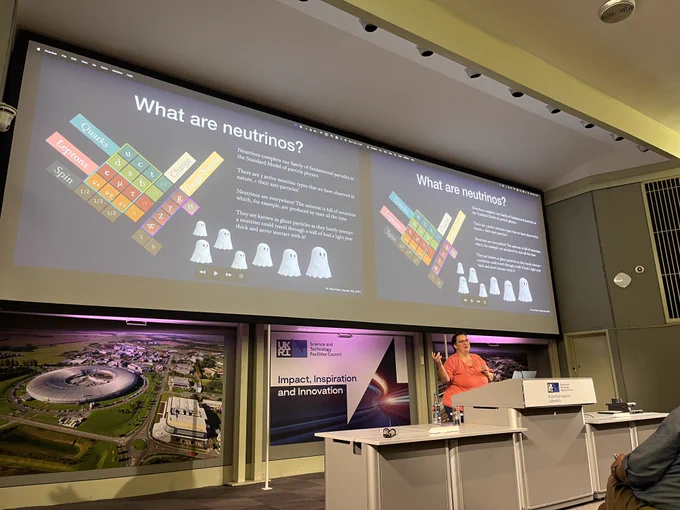 speaker presents talk at podium in lecture theatre 