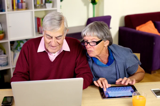 a couple look at their computers