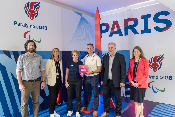 Left to right Richard Wheater, the University’s Director of Sport, Professor Jo Maher, Pro Vice-Chancellor for Sport, Penny Briscoe, Director of Sport for ParalympicsGB, Alasdair Donaldson, the University’s Head of Para Sport, Professor Nick Jennings, Loughborough’s Vice-Chancellor, and Professor Rachel Thomson, Provost and Deputy Vice-Chancellor. Standing in front of Paralympics GB signs