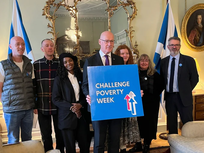 First Minister John Swinney MSP with activists during Challenge Poverty Week.
