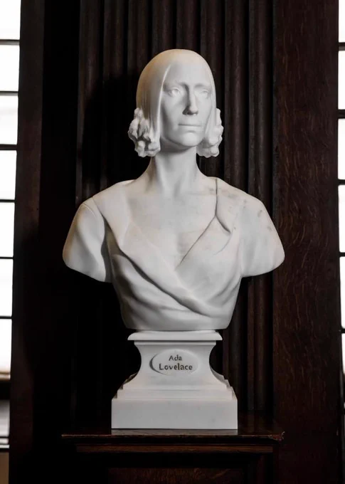 Sculpture of Ada Lovelace on pedestal in the Long Room of the Old Library. Sculpted by artist Maudie Brady. 