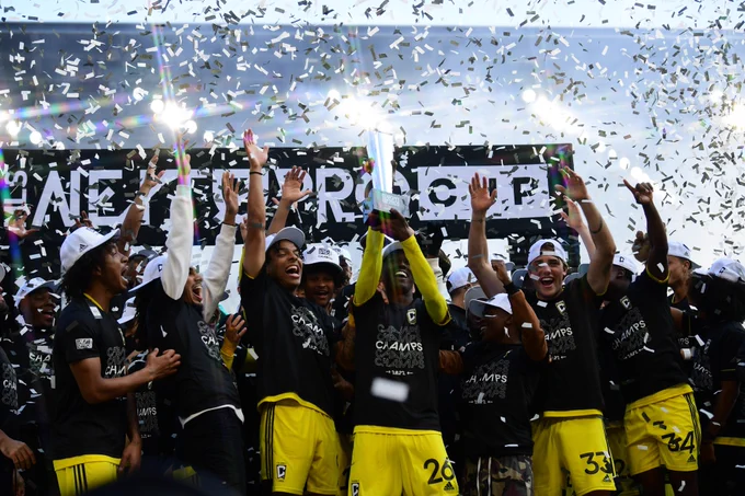 Photo of Columbus Crew 2 lifting the inaugural MLS NEXT Pro Cup.