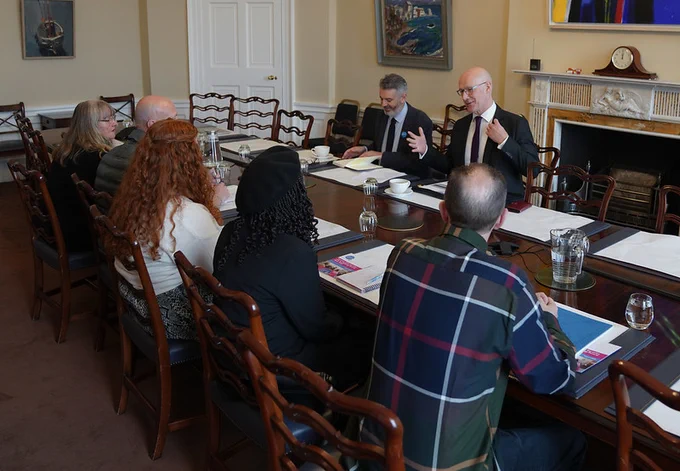 First Minister John Swinney hosting an anti-poverty roundtable with the Poverty Alliance at Bute House.