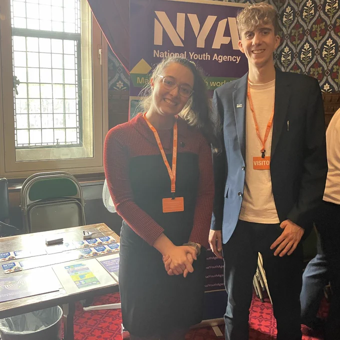 A photo of NYA Policy and Public Affairs Manager, Angel standing with NYA Policy Intern and Youth Project Assessor Harrison Humby. 