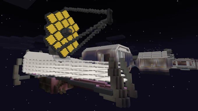 A depiction of the James Webb Space Telescope and an attached space habitat, in the style of Minecraft. Webb's distinctive golden mirror and giant sunshield are rendered in block form, with pinpoint stars dotting the image's background. Credit: Minecraft
